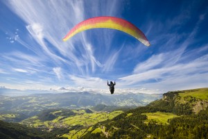 http://www.dreamstime.com/stock-image-paraglider-flying-over-mountains-summer-day-image45678011