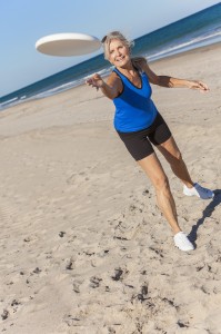 http://www.dreamstime.com/royalty-free-stock-images-fit-healthy-senior-woman-playing-frisbee-deserted-beach-sea-image29788179